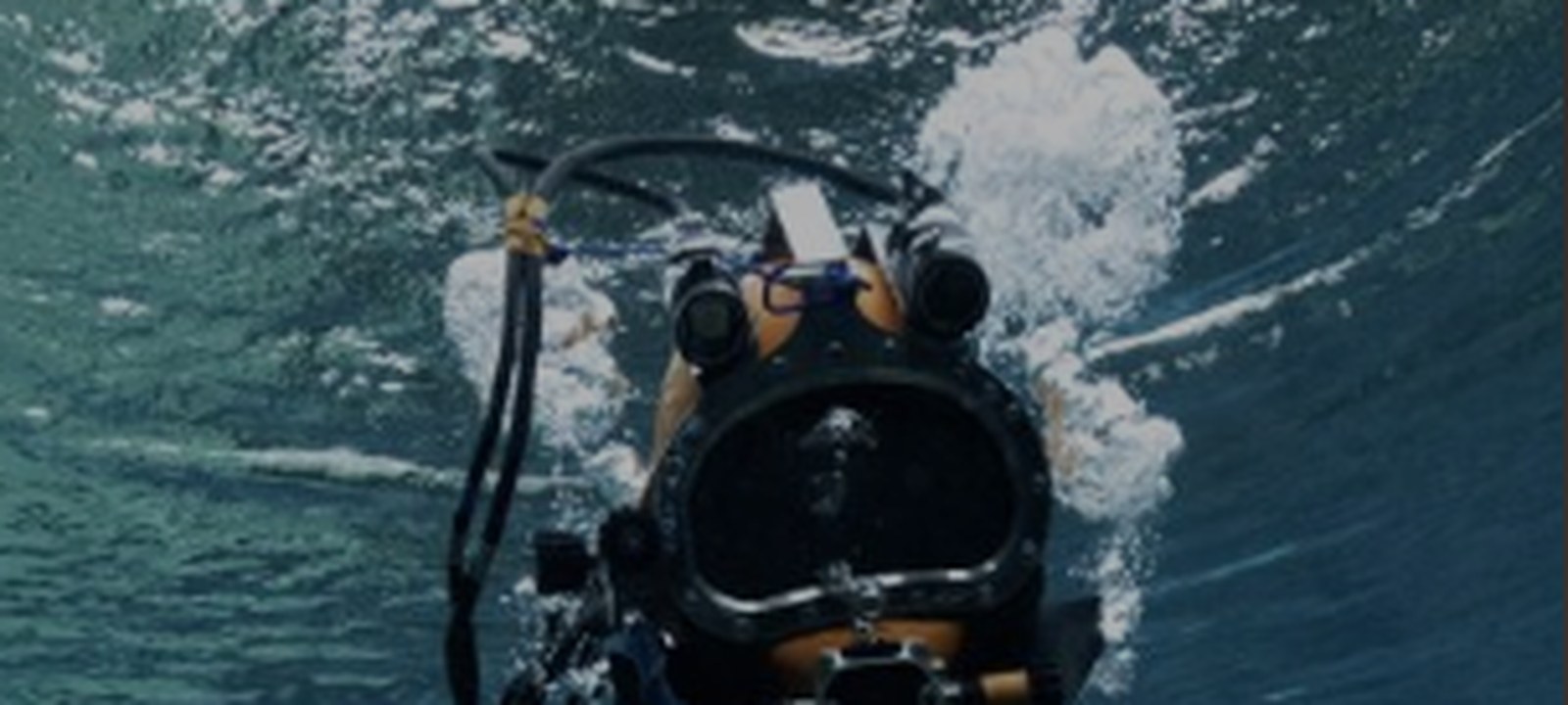 Commercial diver using an underwater hydraulic cutting tool